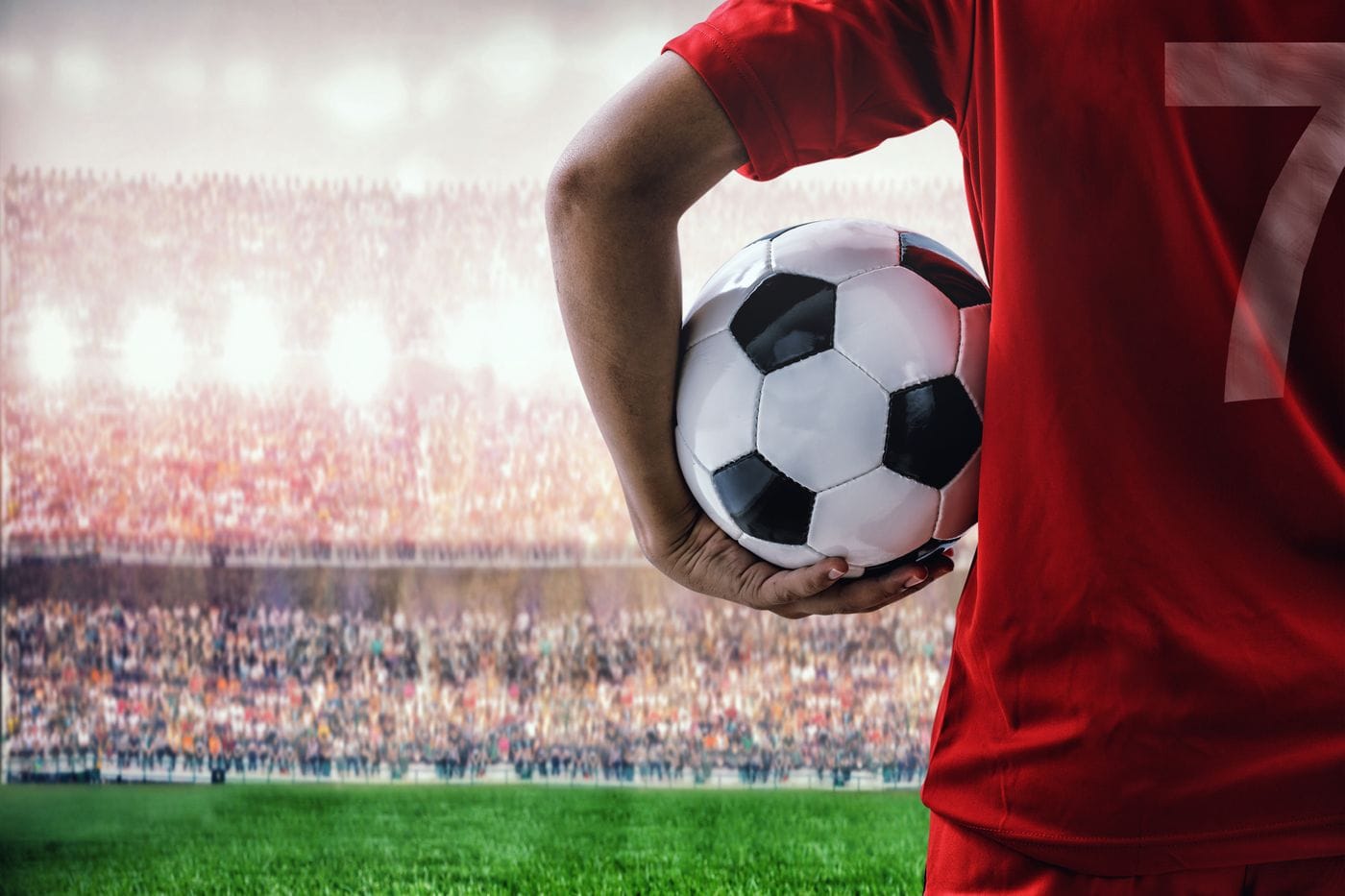 Soccer players standing on field