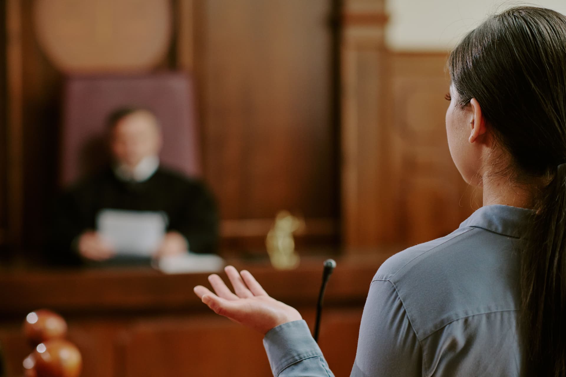 Courtroom witness stand with dramatic lighting