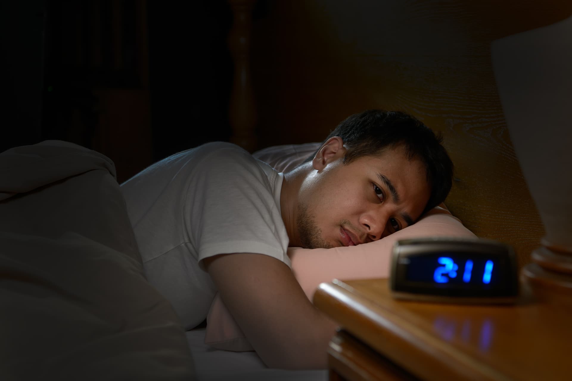 Person lying awake unable to sleep