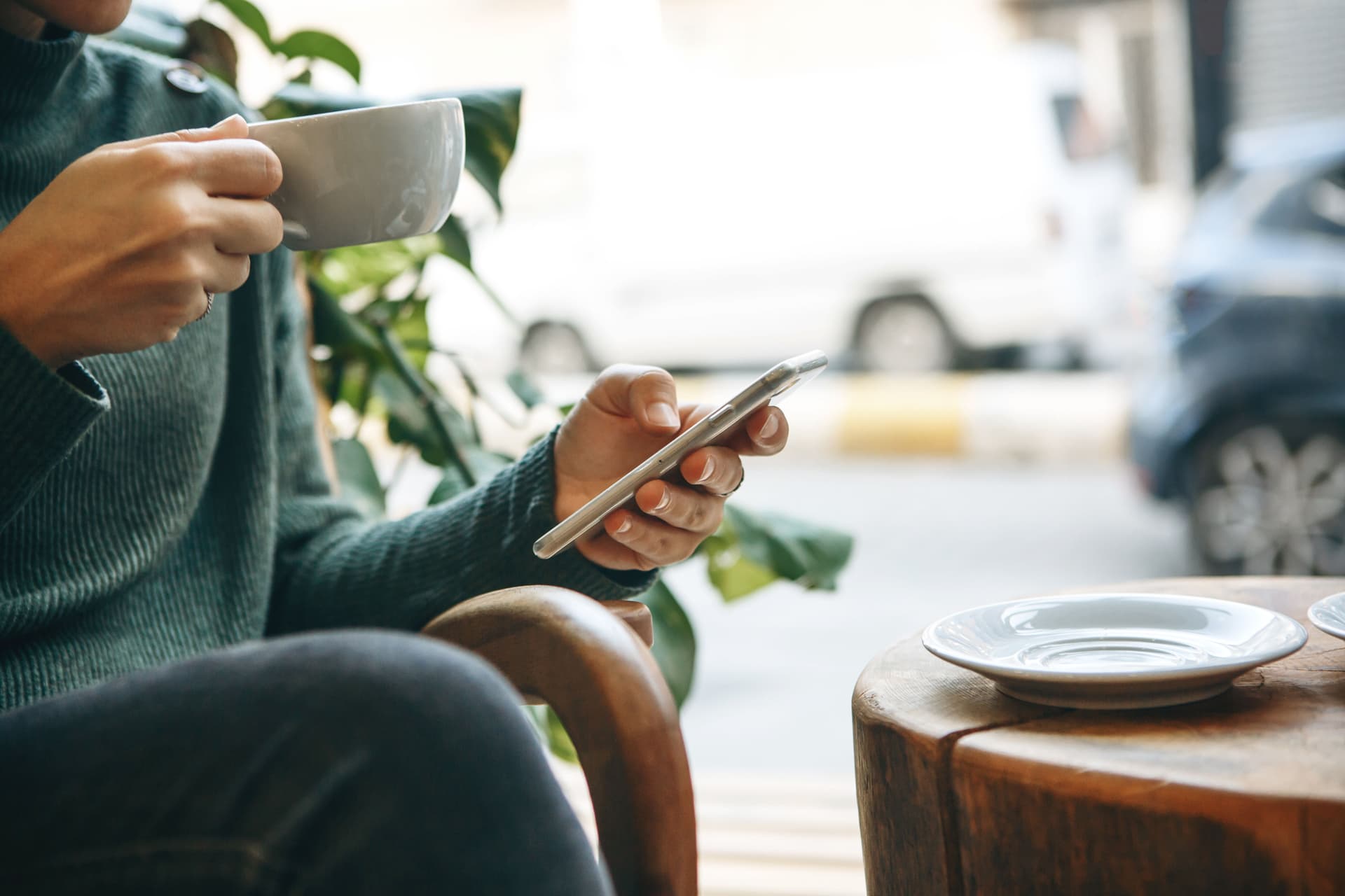 Person checking smartphone with notification alerts